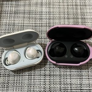 Two Samsung ear buds complete with charging case and silicone case